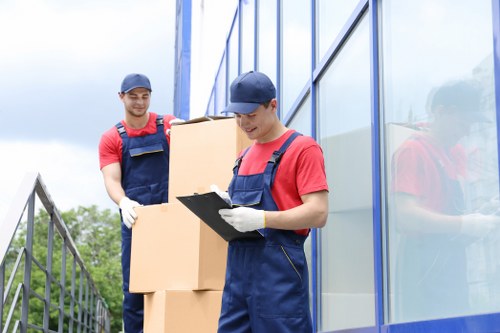 Man and van team handling items safely during a move in Swiss Cottage