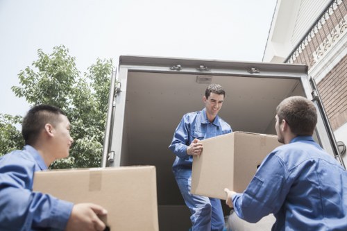 Man and van loading reusable items for recycling in Swiss Cottage