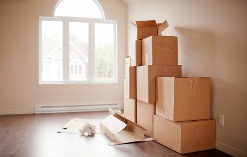 Packed office boxes and equipment ready for a business move