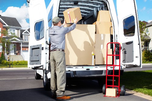 Removal team managing access and loading on a busy Swiss Cottage street
