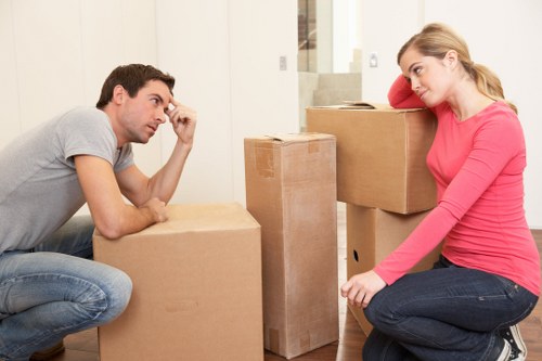 Packed moving boxes ready for transport in a Swiss Cottage home