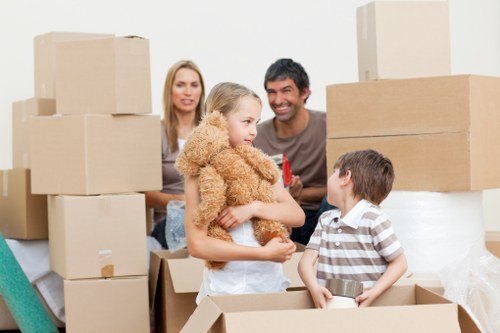 Staff coordinating a careful furniture transfer